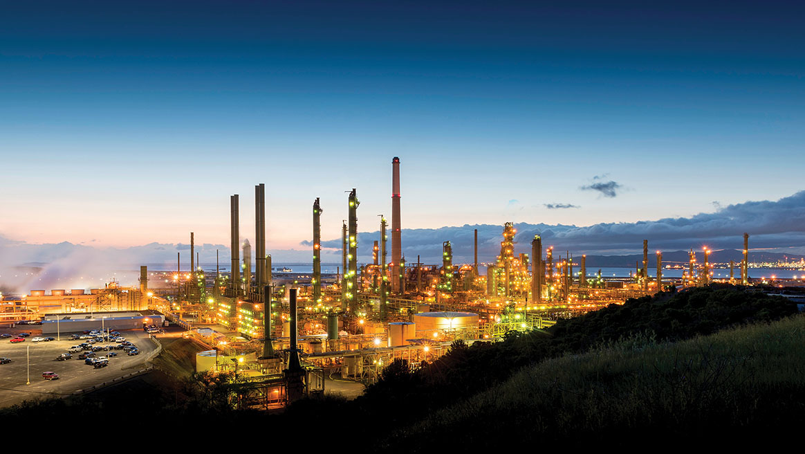 Refinery landscape illuminated at sunrise