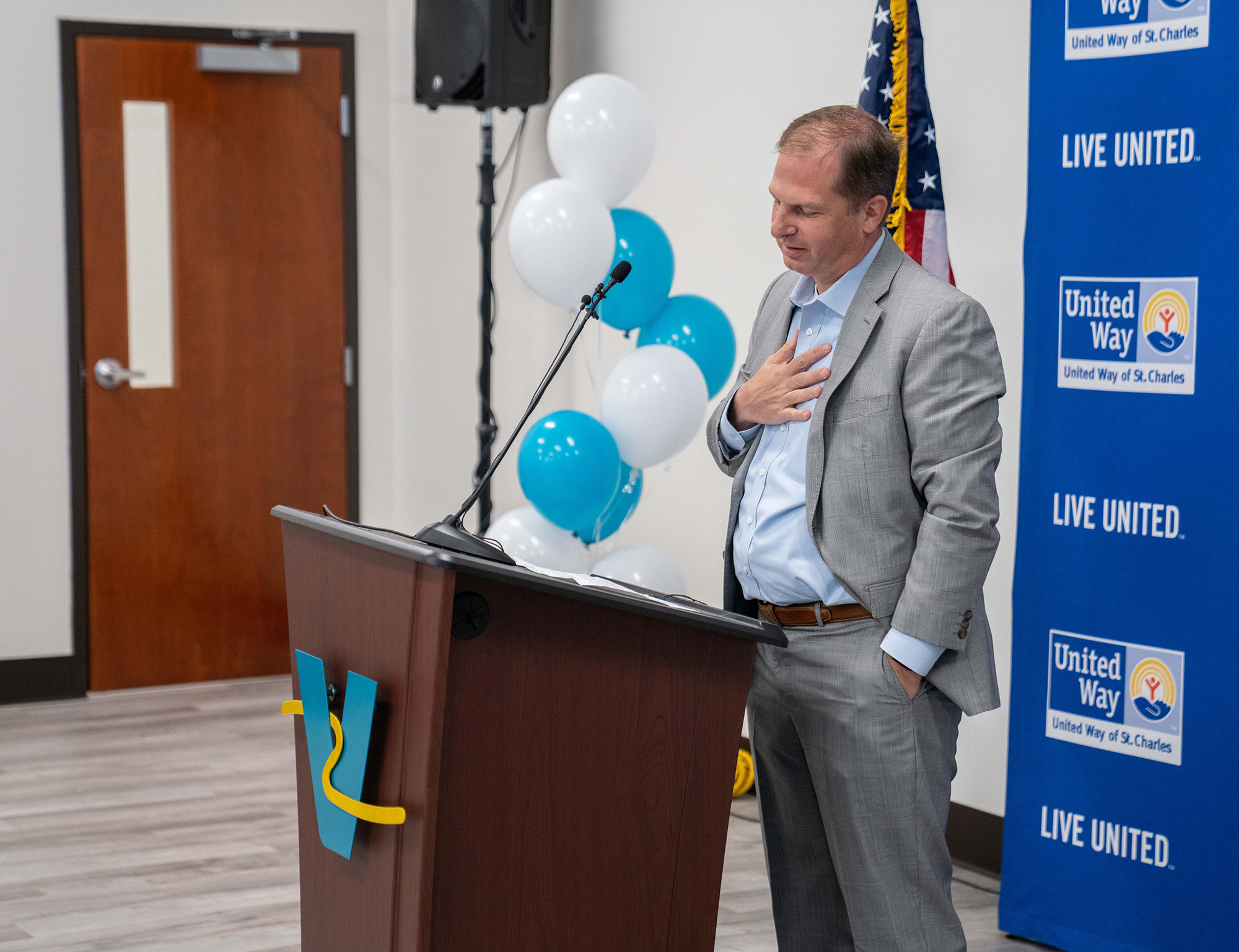 Man speaking at a podium