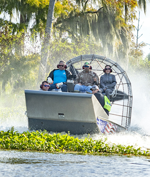 yd7610 Volunteers on an air boat