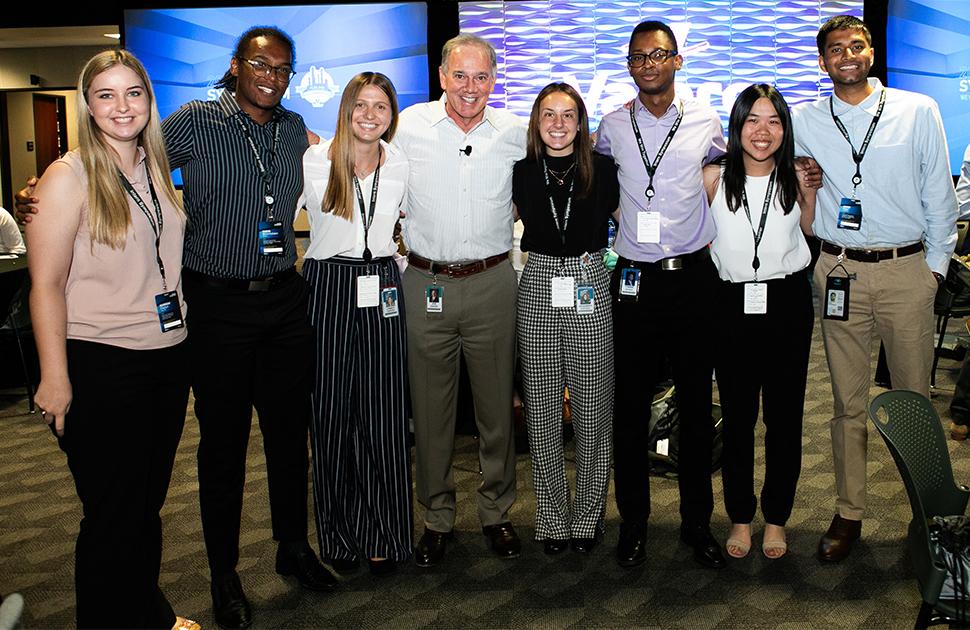 Joe Gorder w/ Interns at Symposium