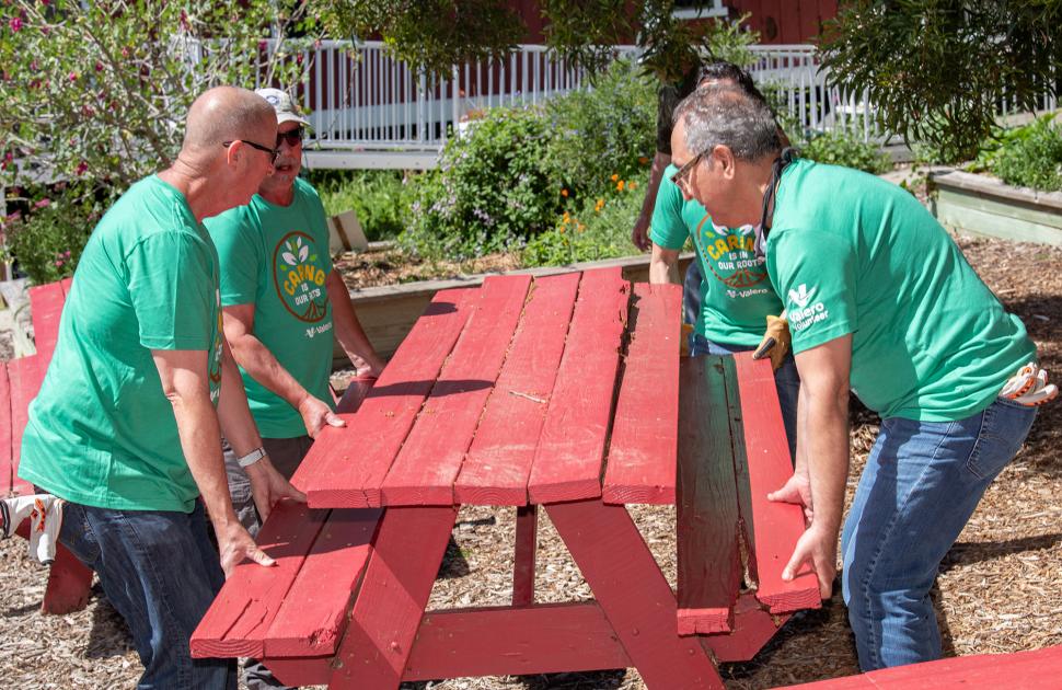 Volunteers move debris as part of Earth Day project