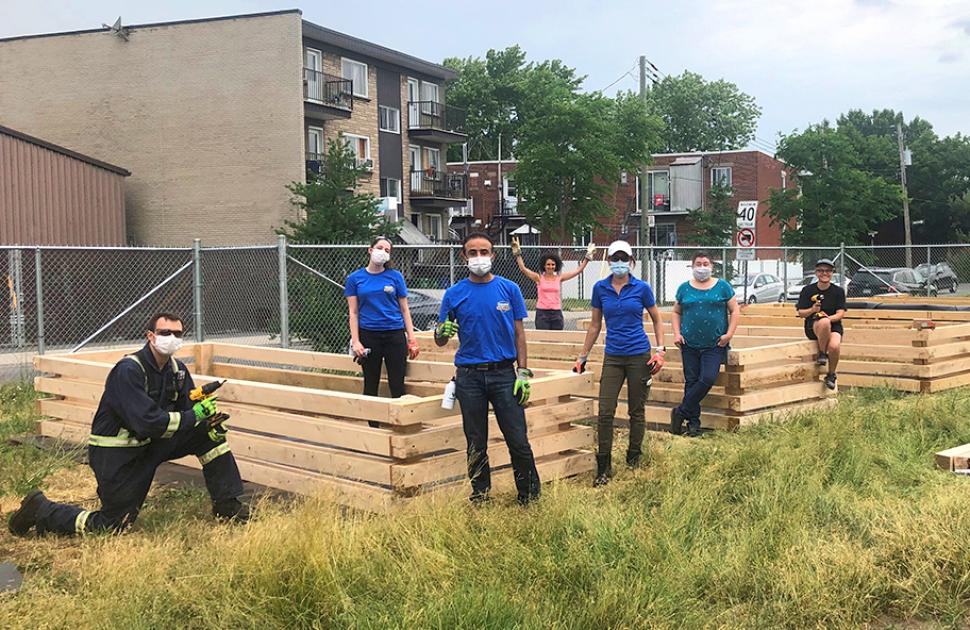 yd7610 Volunteers built large planter boxes as part of a volunteer activity