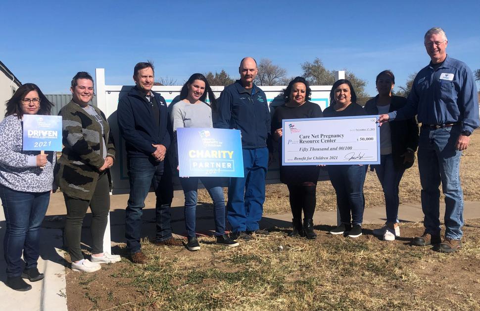 McKee Refinery employees presenting a $50,000 donation to CareNet