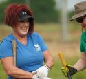 Volunteers laugh together at volunteer event