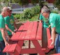 Volunteers move debris as part of Earth Day project