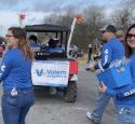 yd7610 volunteers during a parade, handing out goodies