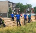 yd7610 Volunteers built large planter boxes as part of a volunteer activity