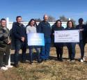 McKee Refinery employees presenting a $50,000 donation to CareNet